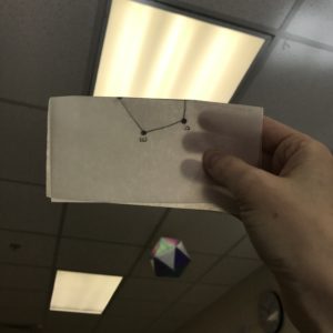 Check for Symmetry by holding paper up to light