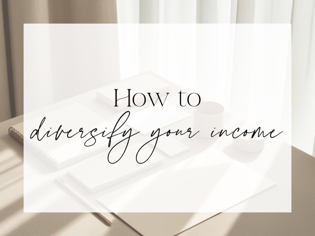 Soft, sunlit desk scene with notebooks, a pencil, and coffee mugs in neutral tones. Over a white overlay, the text reads: “How to diversify your income.”