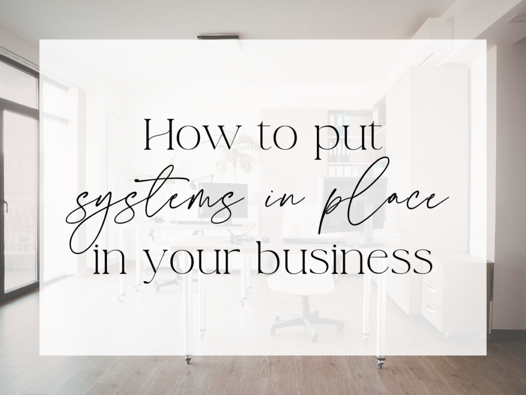 Bright, modern office space with desks, rolling chairs, and shelving in a minimalist setting. Over a white overlay, the text reads: “How to put systems in place in your business.”
